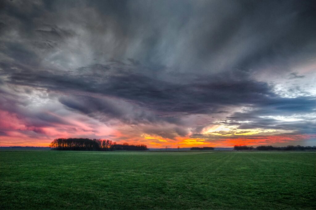 a sunset storm over a field